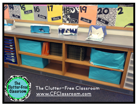 lesson planning materials organized in copy paper boxes that are stored in a classroom bookshelf