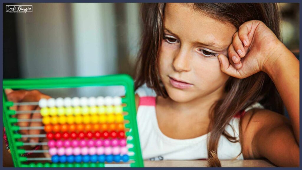 Child with an abacus solving math