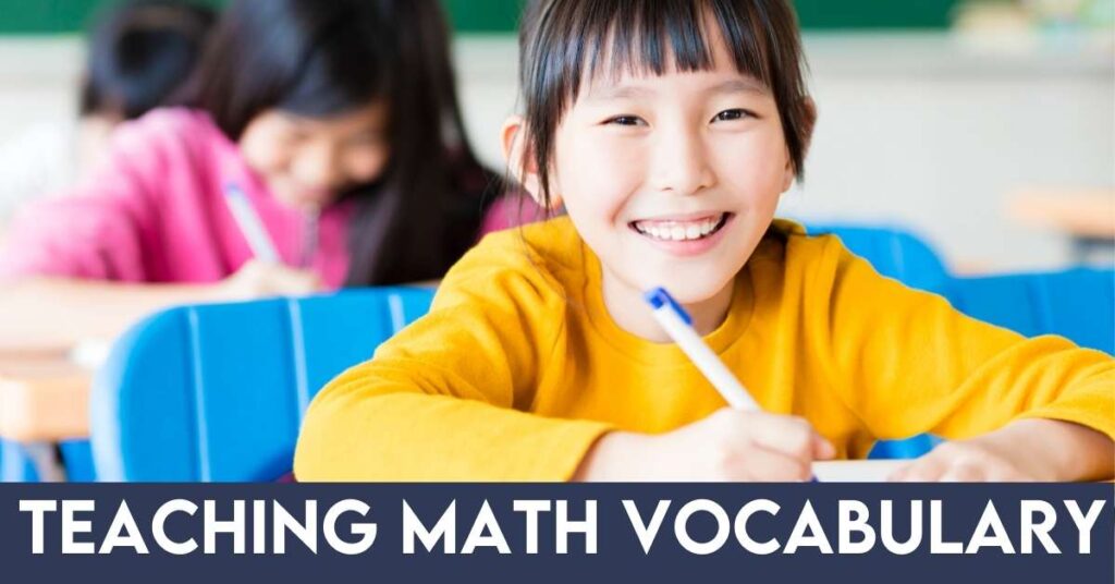 girl in class smiling and writing math vocabulary words