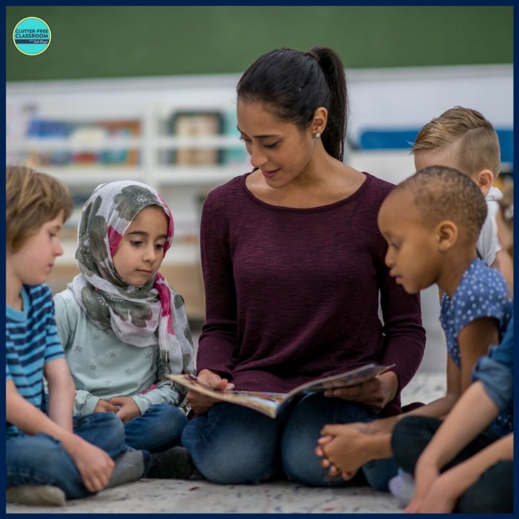 elementary teacher reading aloud a picture book to her students