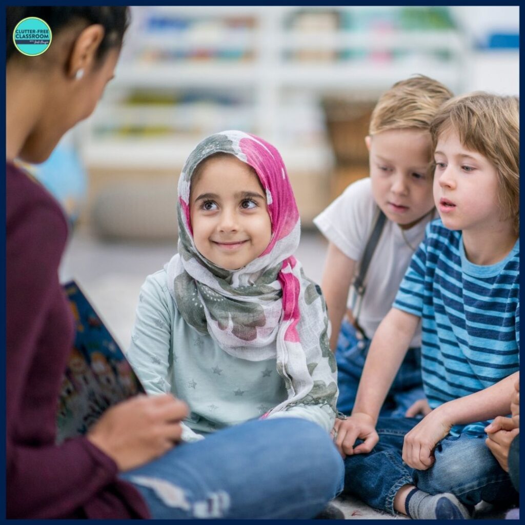 elementary teacher reading aloud a picture book to her students