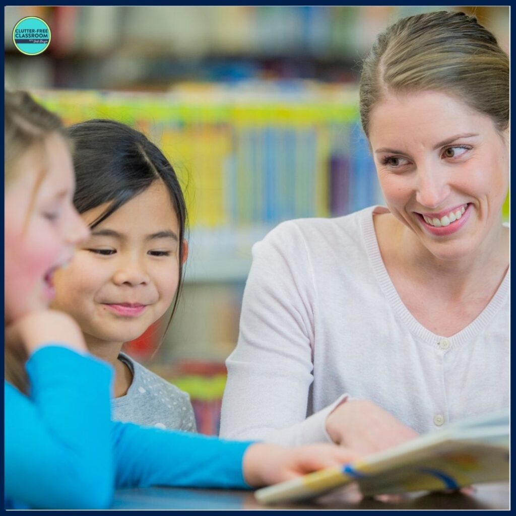 elementary teacher reading aloud a picture book to her students