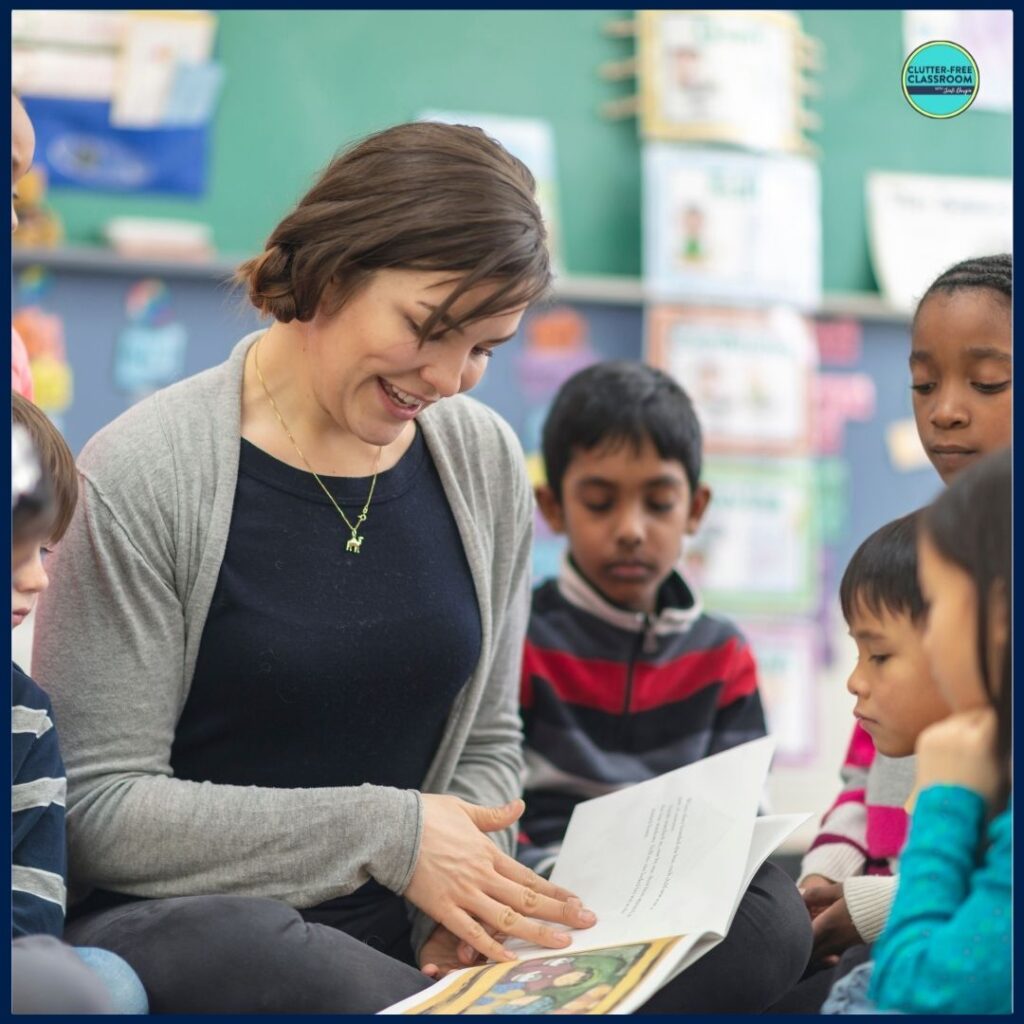 elementary teacher reading aloud a picture book to her students