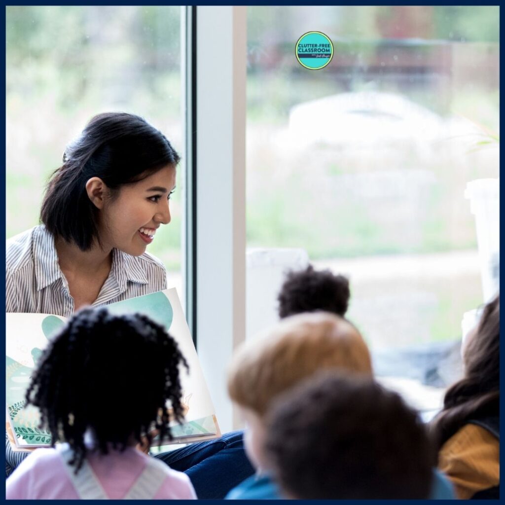 elementary teacher reading aloud a picture book to her students