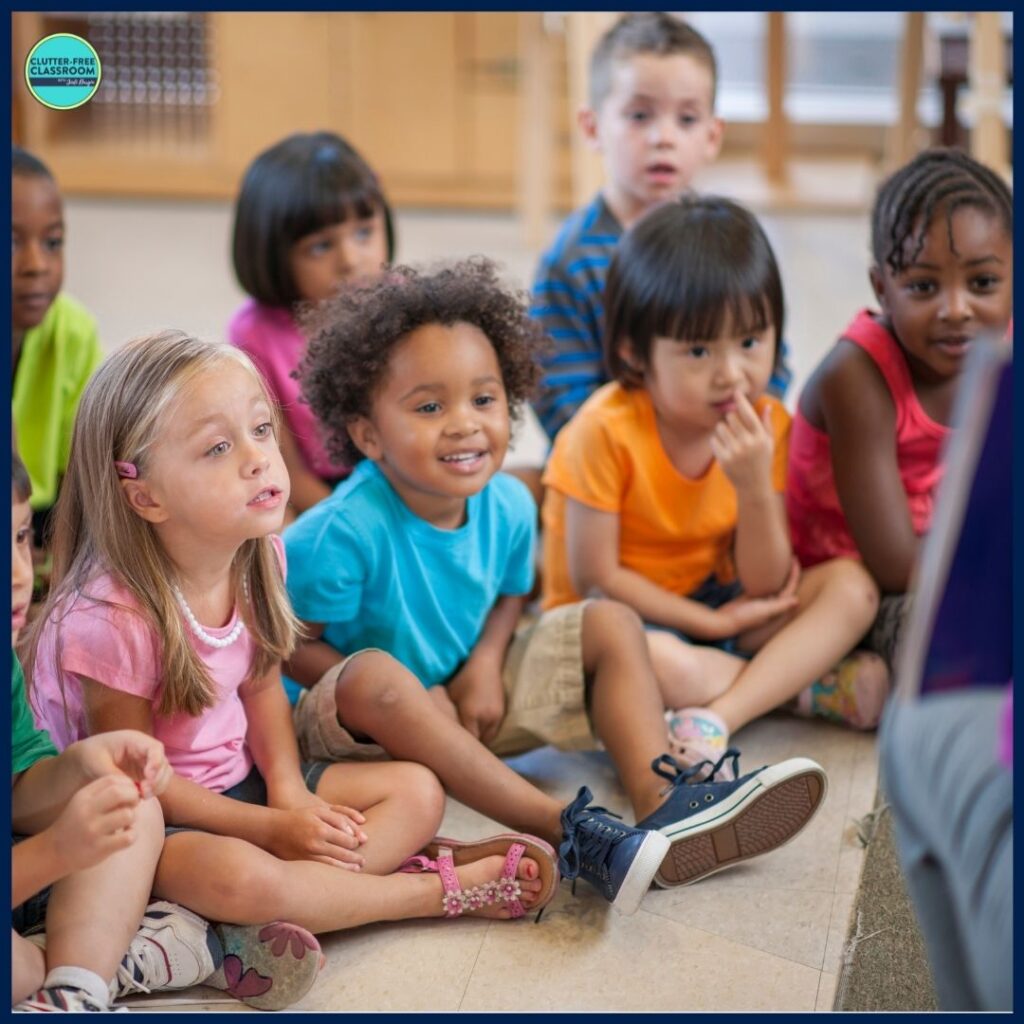 class of students listening to a picture book being read aloud by their teacher