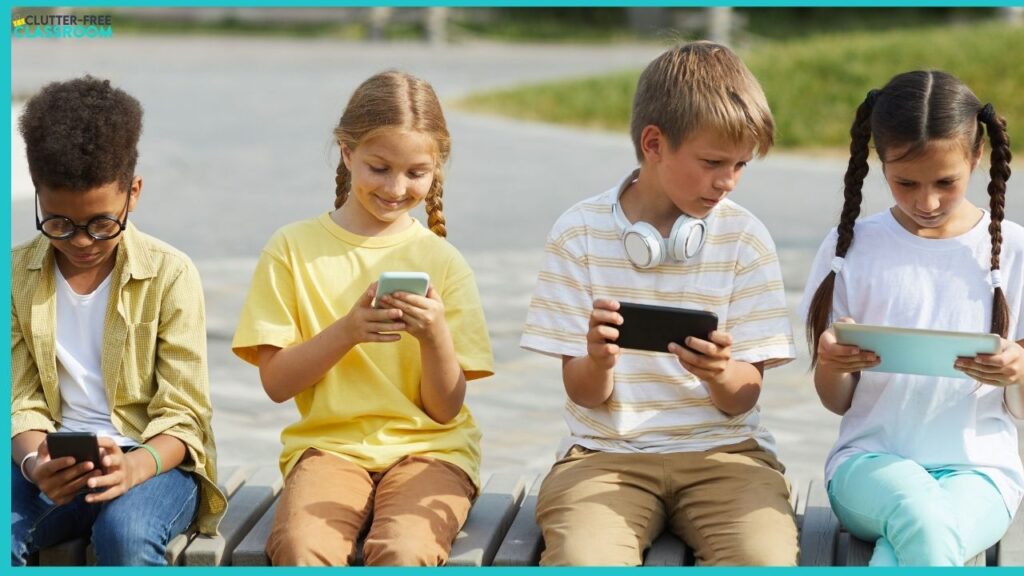 4 kids outside on technology devices not socializing with one another